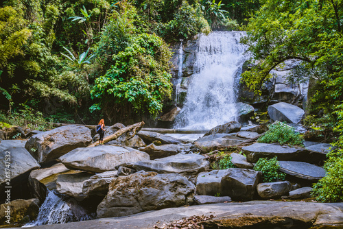 Women travel. woman asia travelers travel nature Forests, mountains, waterfalls. Travel Siliphum Waterfall at Chiangmai, in  Thailand. photo