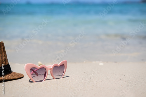 Sunglasses on white sandy tropical beach, Summer vacation and travel concept