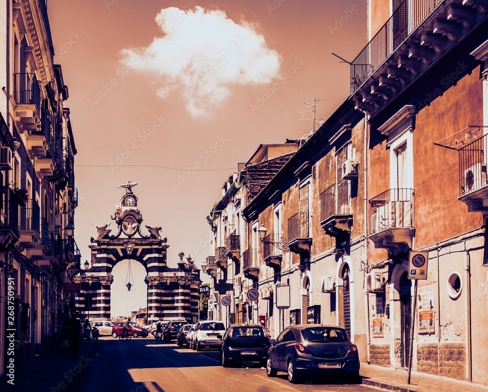 Fototapeta premium Catania, Sicily, Italy, street view of famous landmark – gate Porta Garibaldi in Catania, Sicily, Italy.