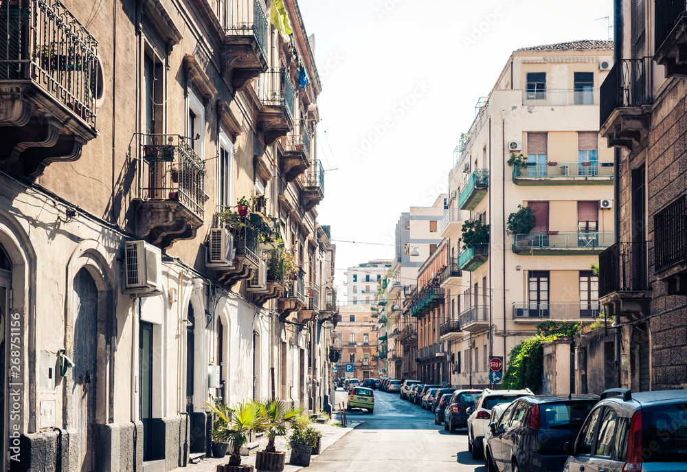 Sicily, beautiful cityscape of Italy, historical street of Catania, facade of old buildings .