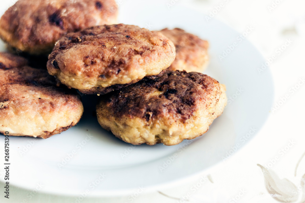 homemade fried minced meat cutlets on white plate, traditional Ukrainian dish .