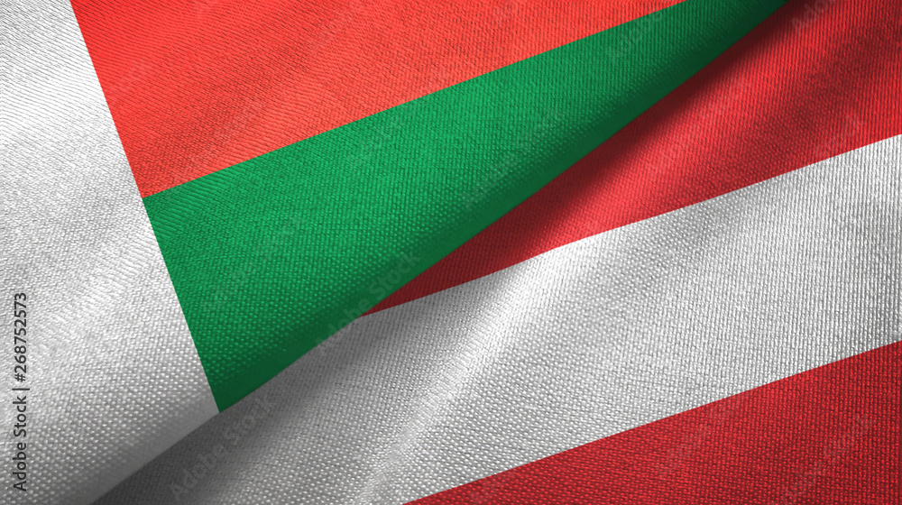 Madagascar and Austria two flags textile cloth, fabric texture 