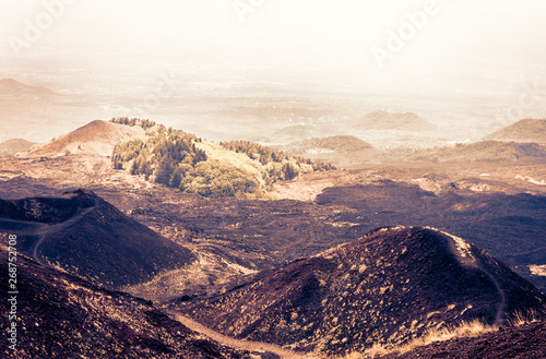 Sicily sunset with Silvestri Craters of Mount Etna, active volcano . photo