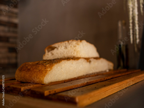 ciabatta in cut form on a wooden surface. italian bread. stirato. focaccia photo