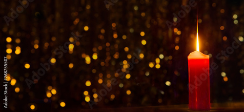 Red candle close up on Festive Background