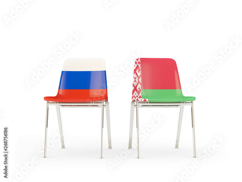 Two chairs with flags of Russia and belarus isolated on white photo