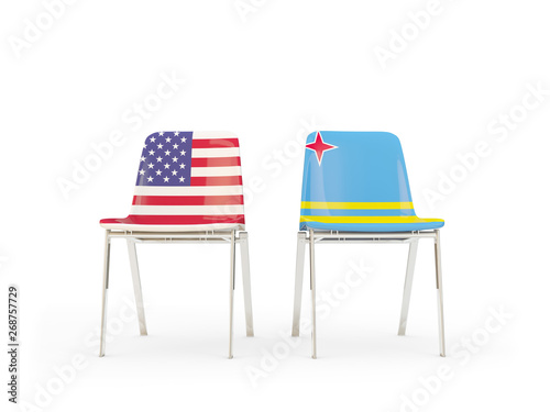 Two chairs with flags of United States and aruba isolated on white