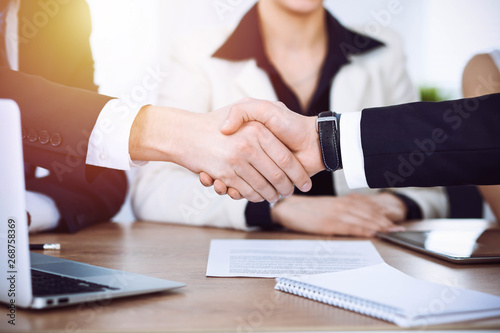 Business people shaking hands at meeting or negotiation in the office. Handshake concept. Partners are satisfied because signing contract © rogerphoto