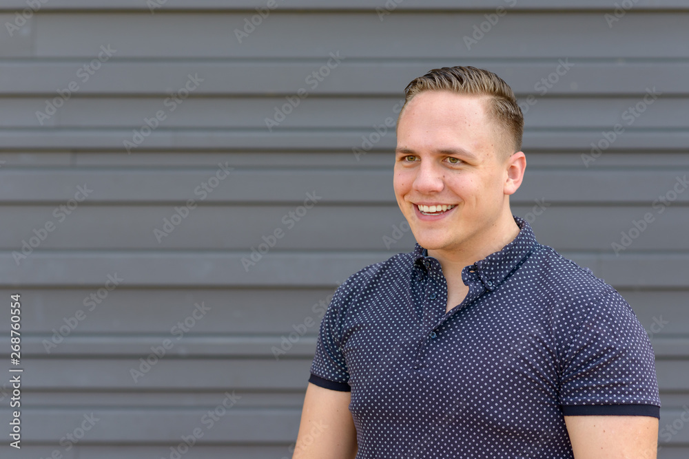 Happy young man with a beaming smile Happy young man with a beaming smile