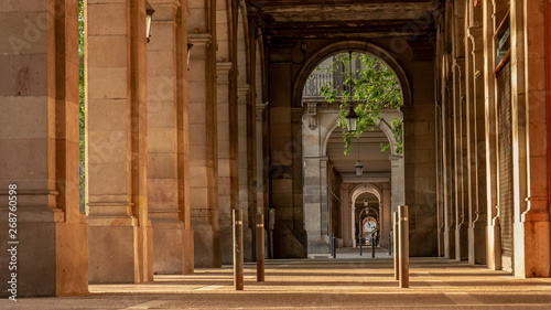 Photography Street with pillars in Barcelona, Spain. Tunnel view.