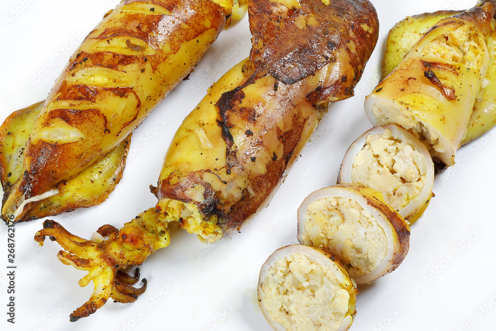 Charcoal grilled stuffed Squid Calamari cattle fish on white background Charcoal grilled stuffed Squid Calamari cattle fish on white background