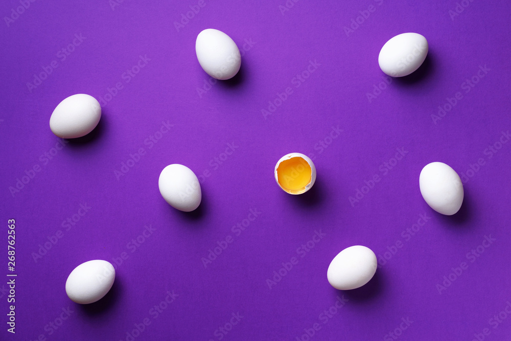 Food concept with white chicken eggs on violet background. Top view. Creative pattern in minimal style. Flat lay. Food concept with white chicken eggs on violet background. Top view. Creative pattern in minimal style. Flat lay.
