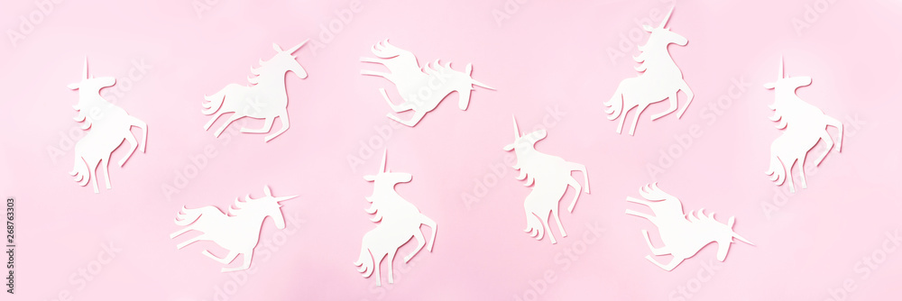 Creative unicorn pattern on pink background. Abstract art texture Minimal fantasy concept. Banner. Top view Creative unicorn pattern on pink background. Abstract art texture Minimal fantasy concept. Banner. Top view