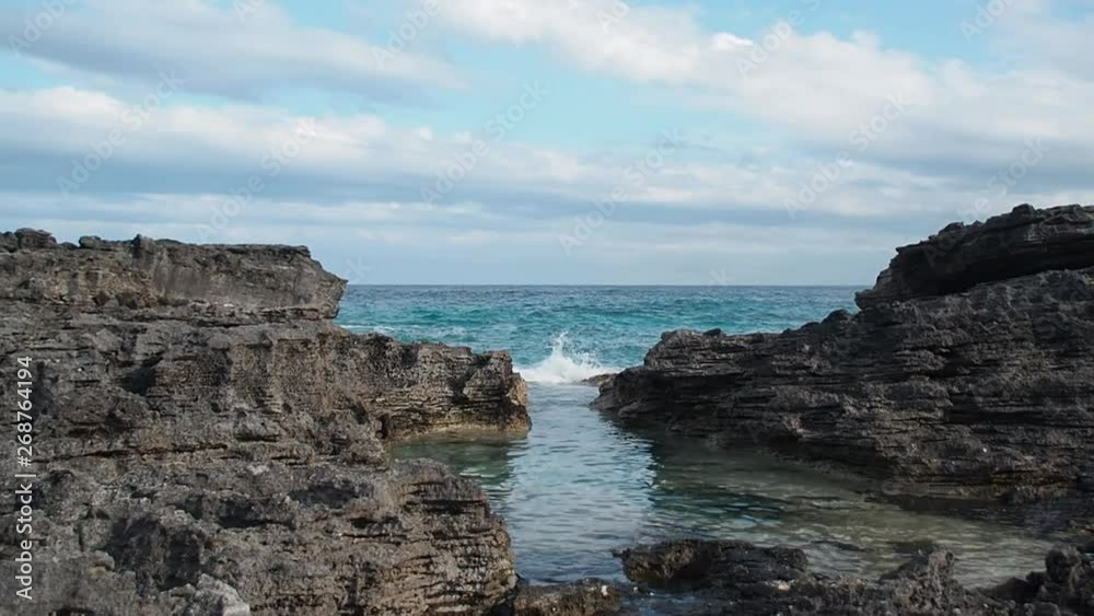 Blue water crashing on the rocks Blue water crashing on the rocks