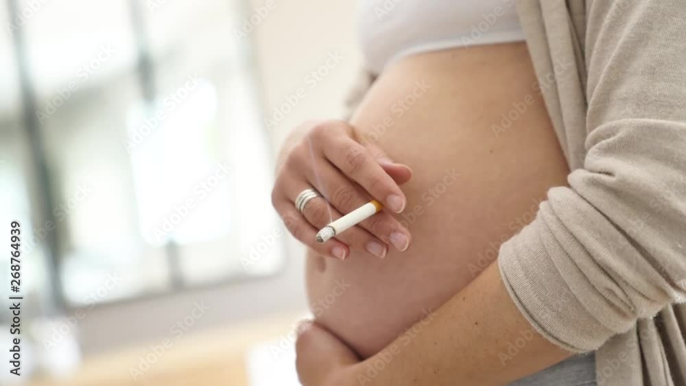 Pregnant woman smoking cigarette