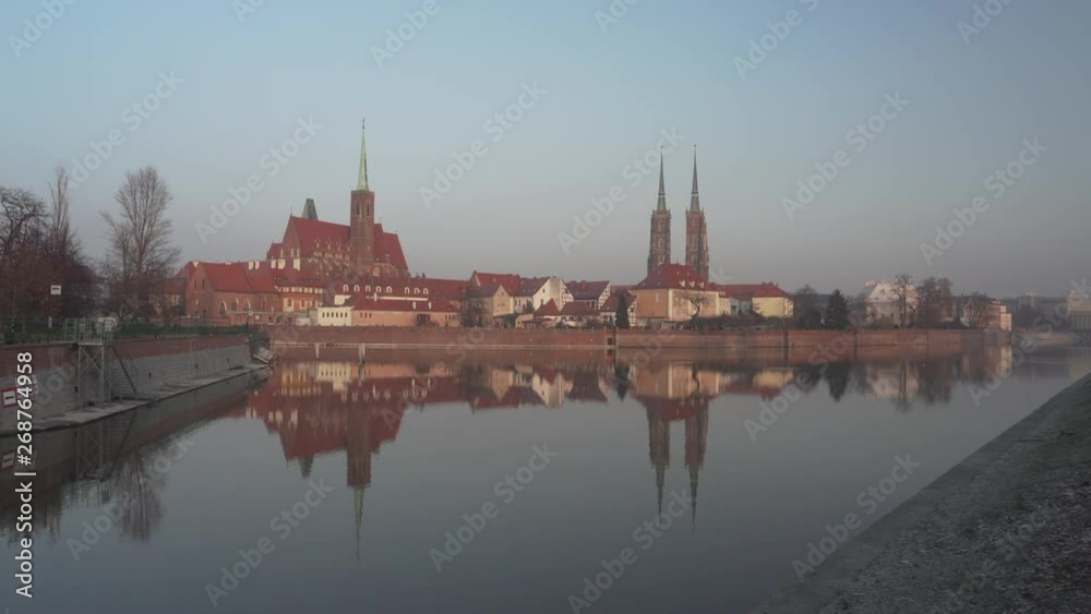 Wide shot of Ostrow Tumski (Cathedral Island), the oldest part of the city of Wroclaw, Poland on January 20, 2019. Sunset, winter day.