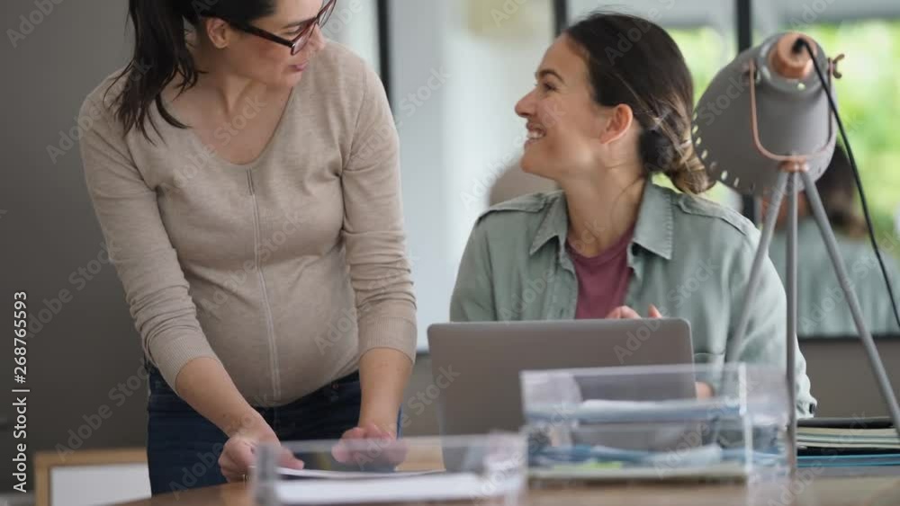 Women working in office on laptop computer Women working in office on laptop computer