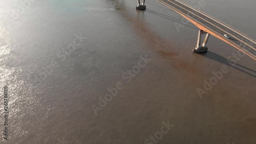 Aerial view of the Mission River bridge with cars travelling over it on a sunny day. photo