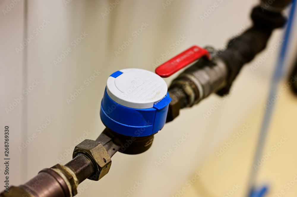 Water flow measurement - water meter on pipe by lever. Water flow measurement - water meter on pipe by lever.