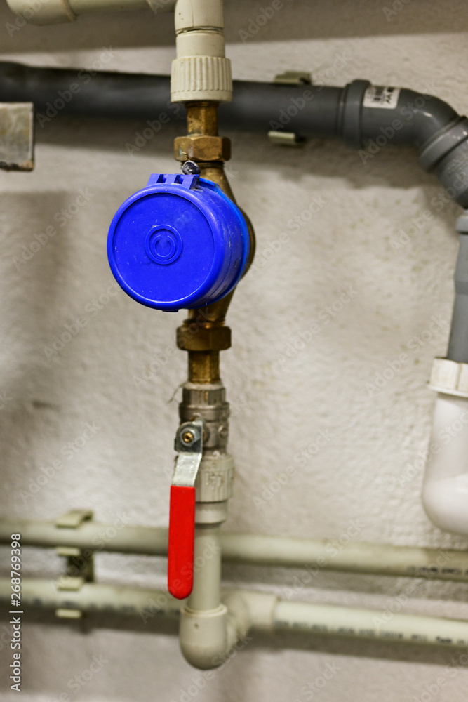 Water flow measurement - water meter on pipe by lever.