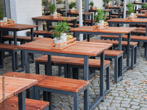 Benches and tables in front of a restaurant