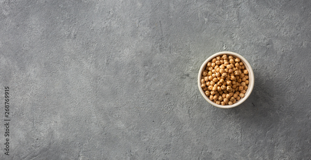 Bowl raw chickpeas on concrete background with a copy space top view Bowl raw chickpeas on concrete background with a copy space top view