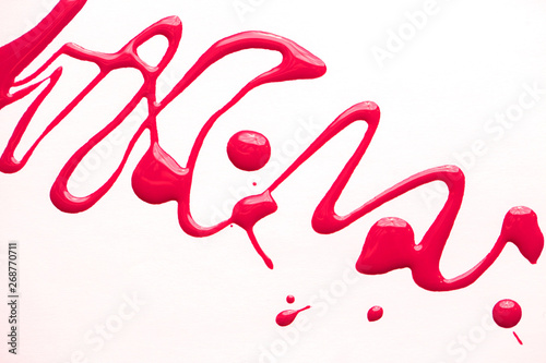 nail polish bottle and drop on white background