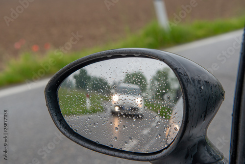 Rear-view mirror with water drops