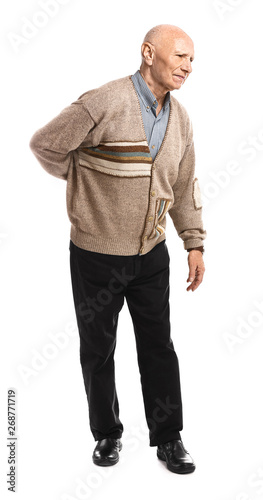 Senior man suffering from back pain on white background © Pixel-Shot