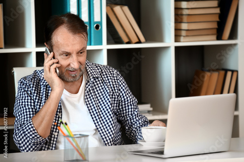 Handsome mature man working...