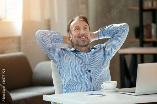 Handsome mature man having ...