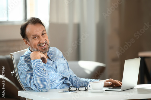 Handsome mature man with la...