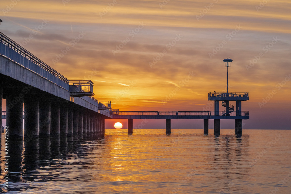 Fototapeta premium Red sunrise in Burgas on the bridge. Scenic sunrise.