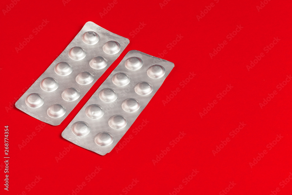 Medical set of Tablets on a red background. Pills Medical set of Tablets on a red background. Pills