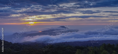 Panorama view sunrise at Doi Inthanon, mountain view morning of peak mountain Doi Hua Suea around with sea of fog with cloudy sky background, KM.41 view point Doi Inthanon, Chiang Mai, Thailand.