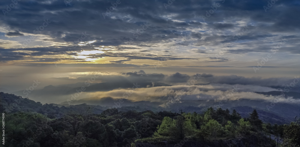 Panorama sunrise at Doi Inthanon, mountain view morning of the hills around with sea of fog with cloudy sky background, KM.41 View Point Doi Inthanon, Chiang Mai, Thailand.