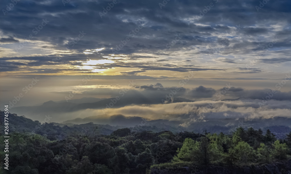 Panorama sunrise at Doi Inthanon, mountain view morning of the hills around with sea of fog with cloudy sky background, KM.41 View Point Doi Inthanon, Chiang Mai, Thailand.
