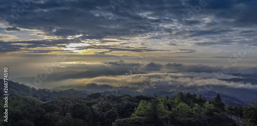 Panorama sunrise at Doi Inthanon, mountain view morning of the hills around with sea of fog with cloudy sky background, KM.41 View Point Doi Inthanon, Chiang Mai, Thailand.