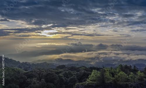 Panorama sunrise at Doi Inthanon, mountain view morning of the hills around with sea of fog with cloudy sky background, KM.41 View Point Doi Inthanon, Chiang Mai, Thailand. © Yuttana Joe