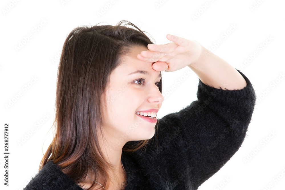 Teenager girl on white background looking far away with hand to look something Teenager girl on white background looking far away with hand to look something