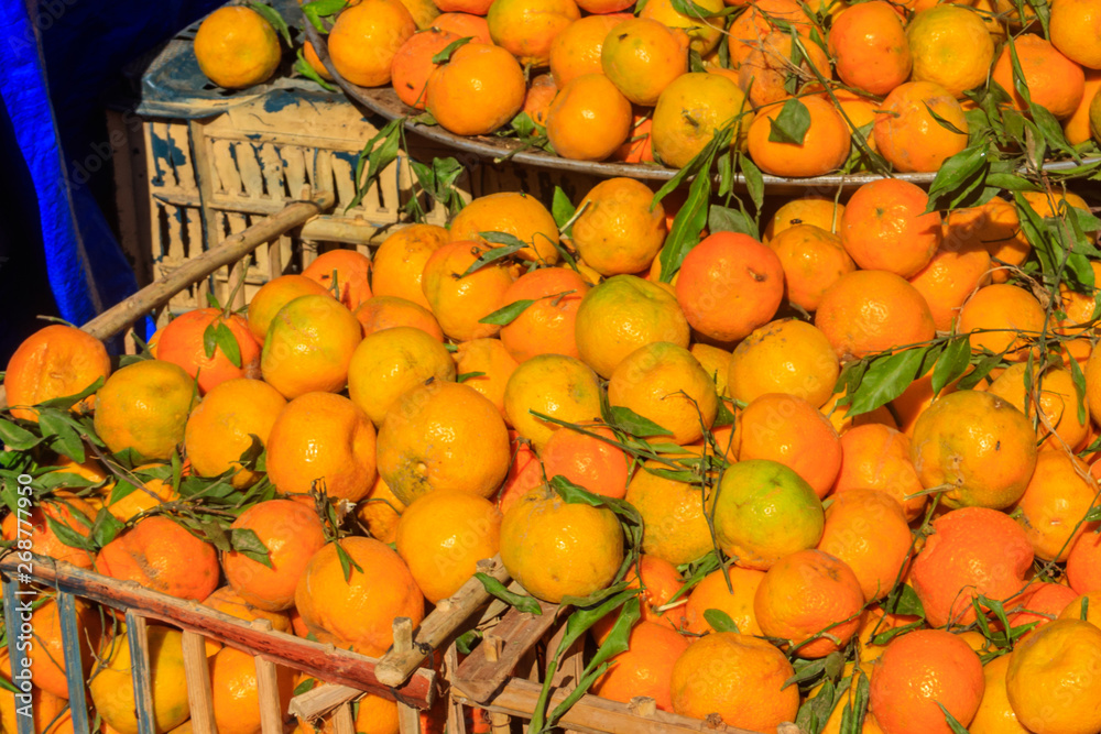 Heap of fresh mandarins for sale in fruit market