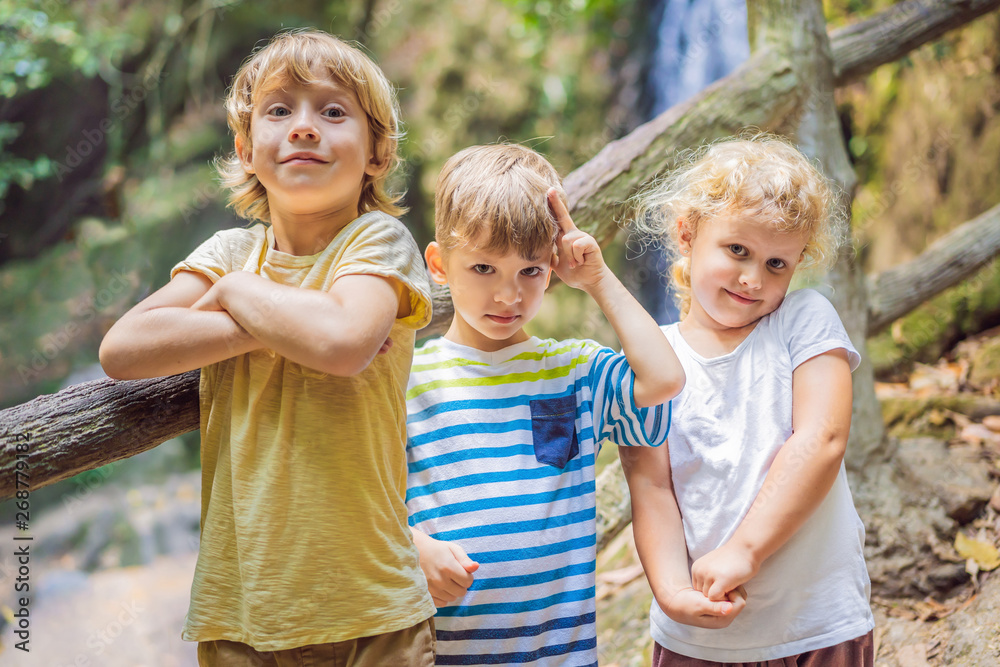 Fototapeta premium Children rest during a hike in the woods