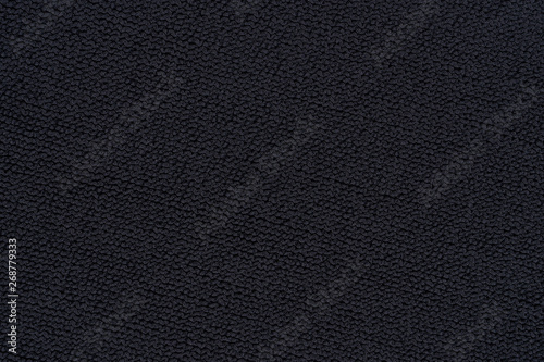 Black cloth texture closeup. Abstract textile detailed background.