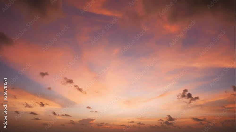 The sun sets with black clouds moving through.Time Lapse The sun sets with black clouds moving through.Time Lapse