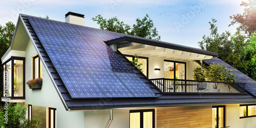 Solar panels on the gable roof of a beautiful modern home photo