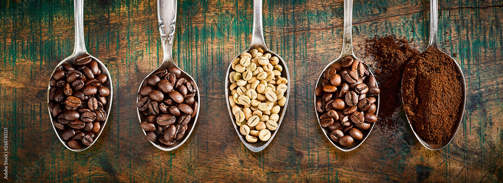 Assortment of different coffee in vintage spoons - obrazy, fototapety, plakaty 