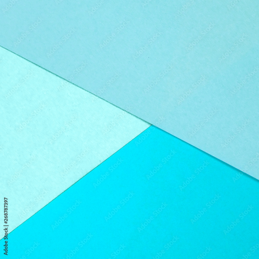 Shade of blue paper geometric flat lay background