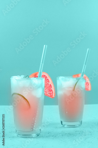 Wallpaper Mural Two glasses of refreshment grapefruit cocktail on mint background Torontodigital.ca