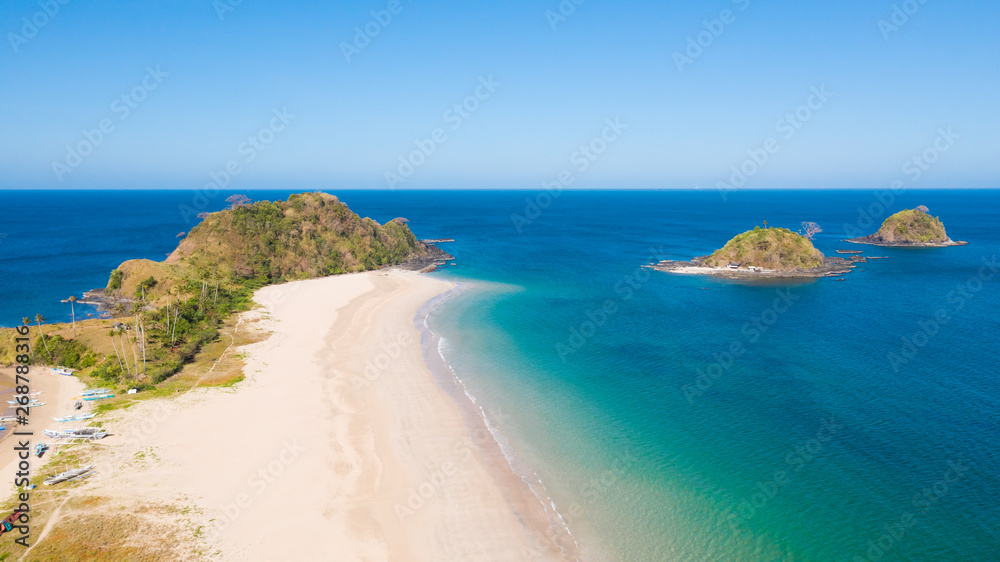 Wide white sand beach Nacpan Beach. El Nido, Palawan, Philippine Islands.Seascape with tropical beach and islands.Summer and travel vacation concept