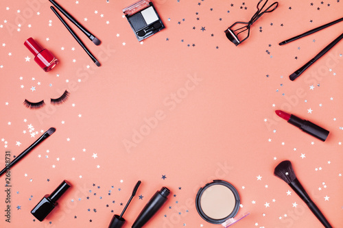 Konstfotografi Beauty products and cosmetic for woman makeup decorated star confetti on coral table top view